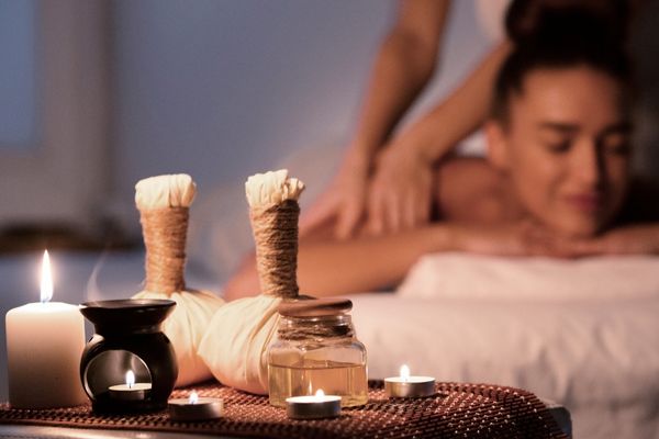Relaxing spa ambiance with candles and oils.